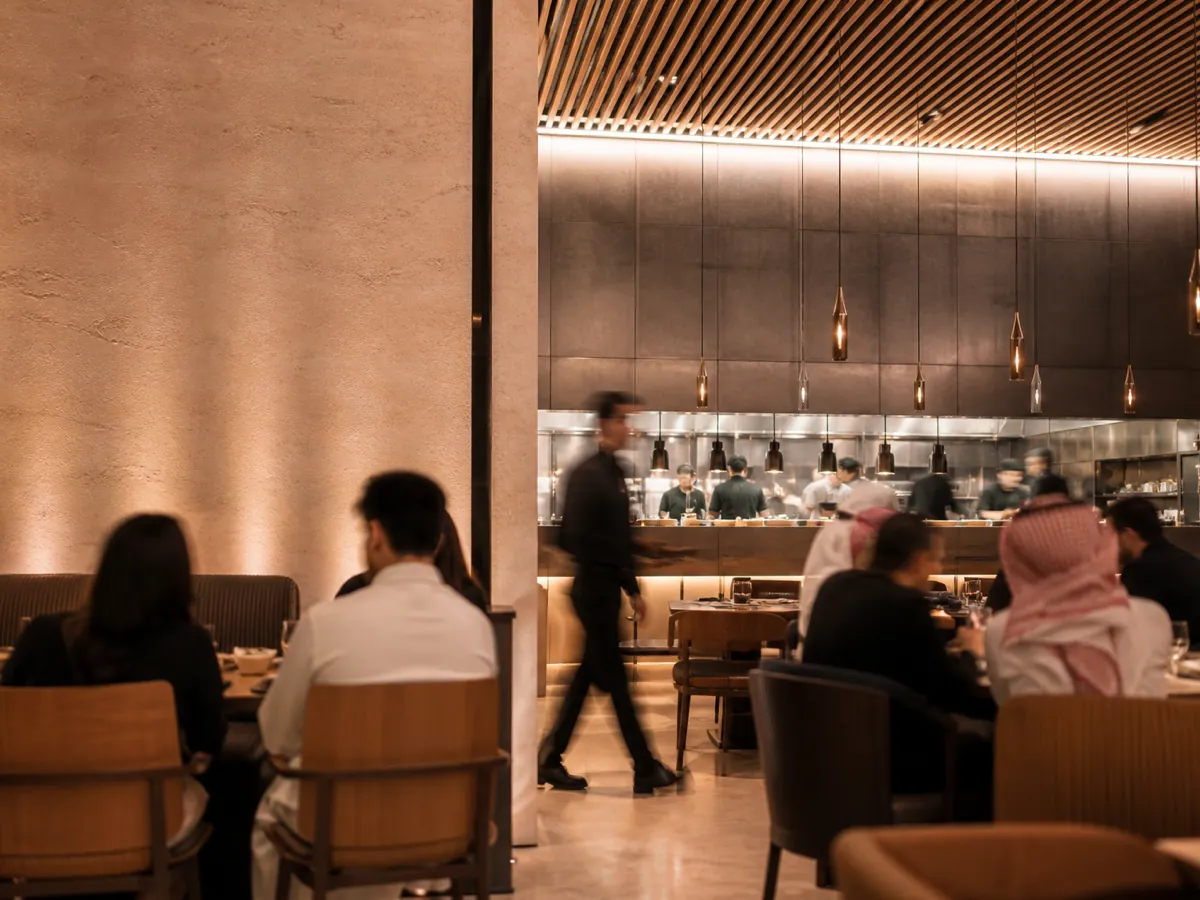 A busy modern Gulf restaurant during evening service